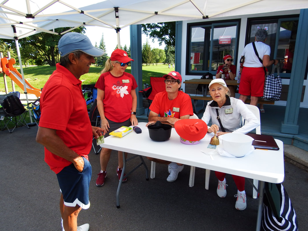 Players checking in at the tournament table
