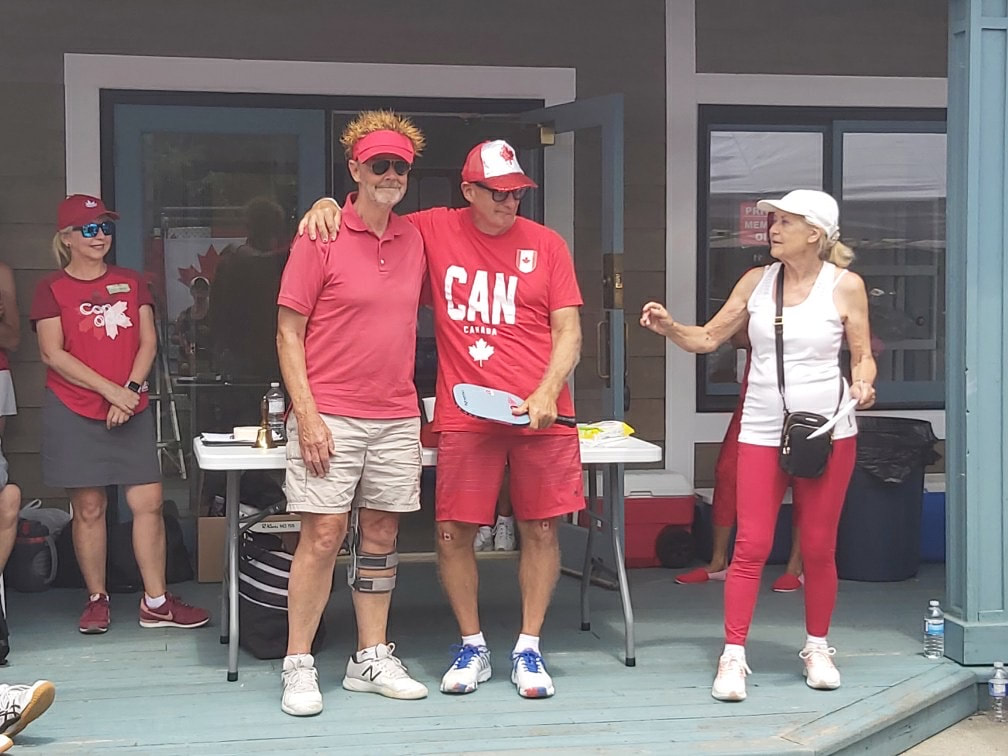 A player in a CAN shirt on the clubhouse deck